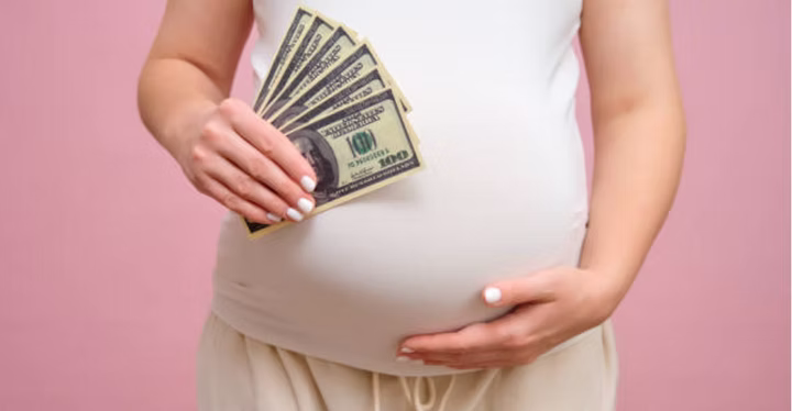 Pregnant belly with money