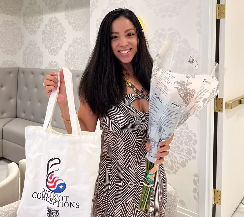 Egg donor with Patriot Conceptions bag and flowers