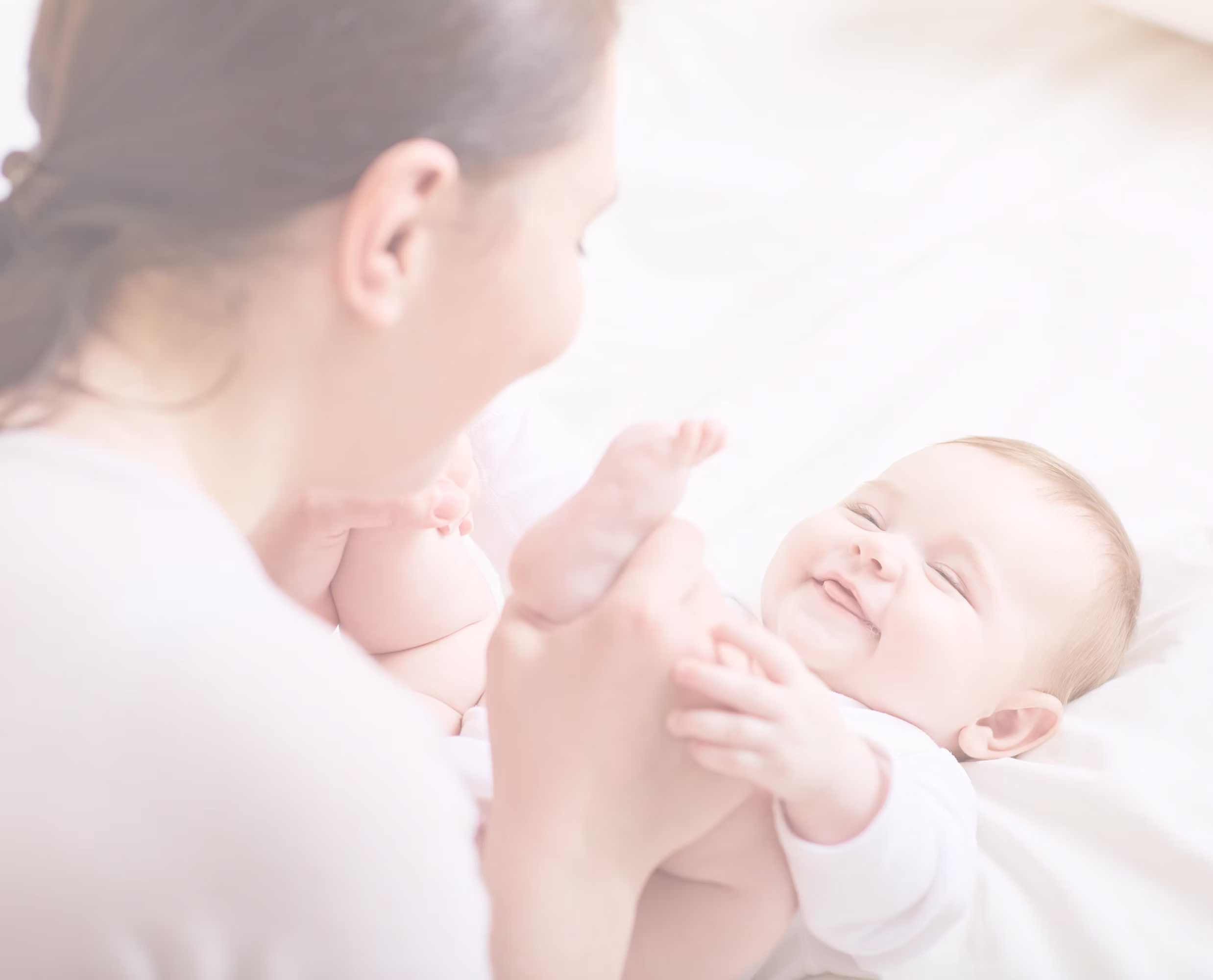Joyful intended parents holding their newborn baby, a result of their successful surrogacy journey.